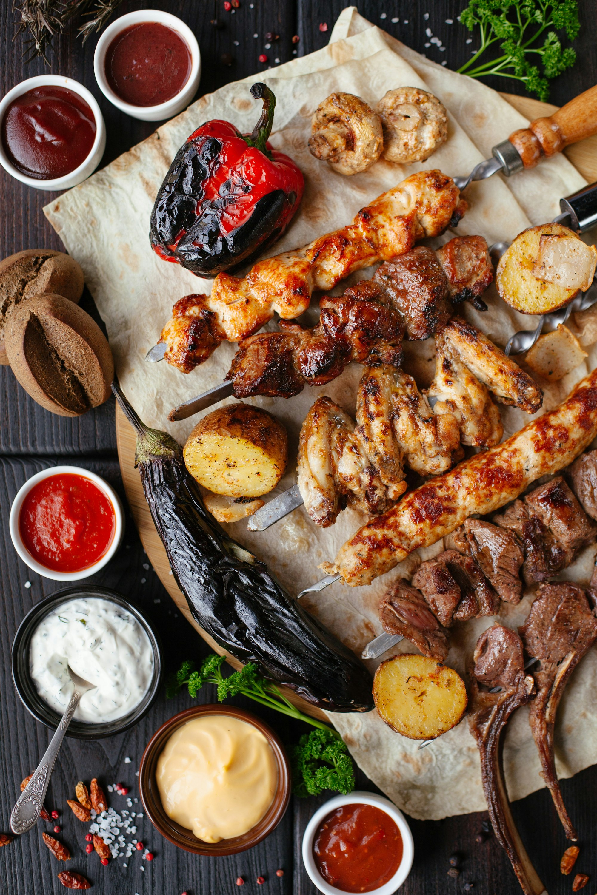 Open fire cooking at night — atmosphere, not this lodge